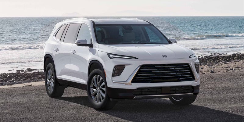 Front three-quarter view of white Buick Enclave SUV